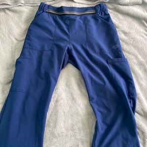 Women’s Dickies Size Small Scrub pant with flare bottoms. Navy blue.